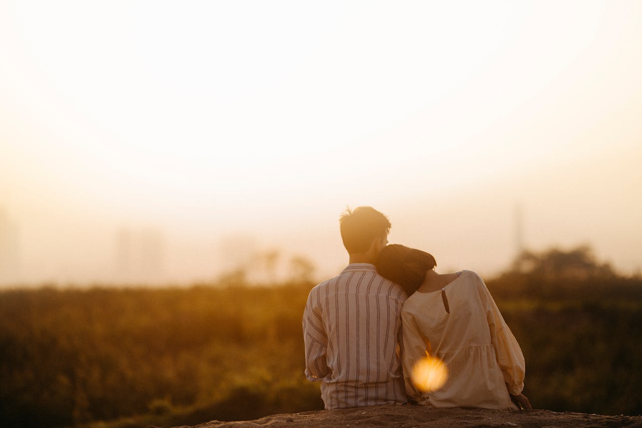 Photo of couple looking at the sunset together by Jasmin Wedding Photography